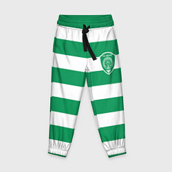 Детские брюки ФК Ахмат на фоне бело зеленой формы